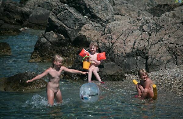 People are engaged in a nudism among rocks [Nudism-Planet]