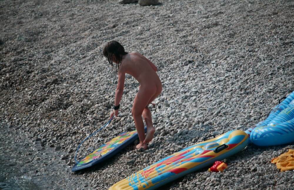 Naturist Surf Board Glides pics - A well-known naturist center