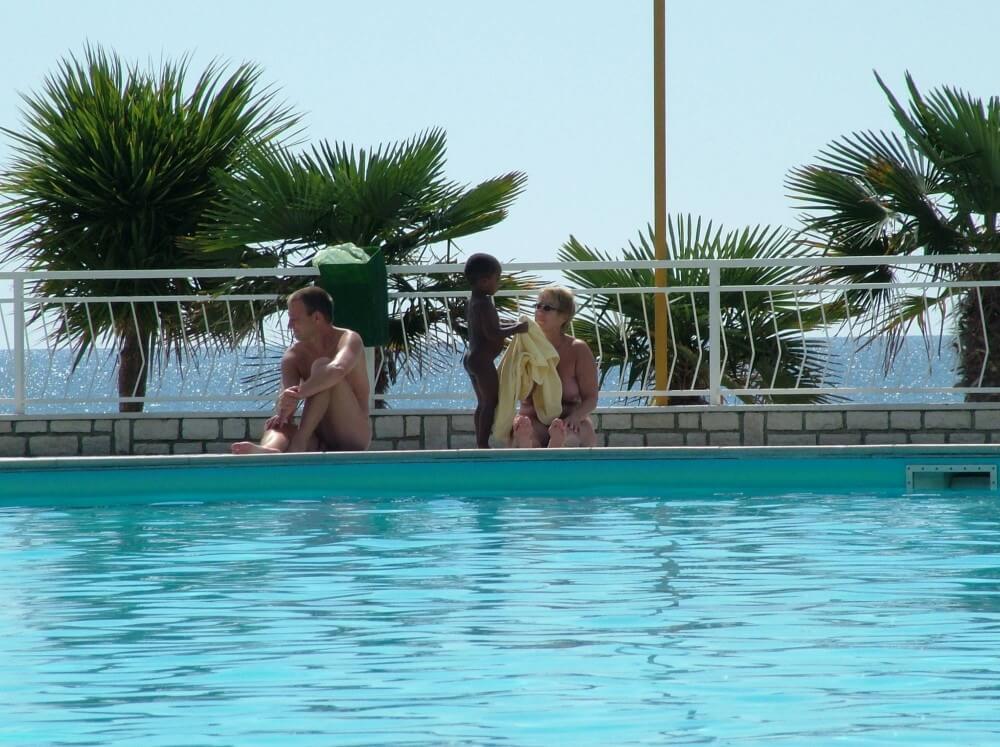 Photo of naturists in an outdoor pool - Nudity is an expression of natural beauty